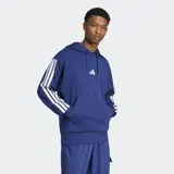 Canguro Adidas de felpa francesa color azul, con capucha y cordón ajustable, bolsillo canguro frontal y hombros caídos. Cuenta con las icónicas tres tiras blancas en las mangas y el logo de la marca bordado en el pecho.