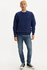 Jean de corte skinny color azul, tiro alto, confeccionado en tejido stretch.