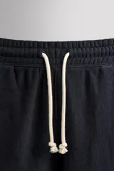 Pantalón jogger relaxed fit de Zara Athleticz confeccionado en tejido de algodón color marrón, con cintura elástica ajustable mediante cordón en contraste, bolsillos laterales y bajo con puño elástico.