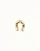 Aro piercing de metal plateado con forma de herradura y pequeños detalles circulares.