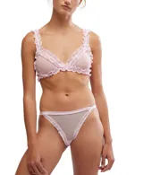 Conjunto de lencería compuesto por un bralette triangular y una bombacha tipo tanga, confeccionados en tul transparente con diseño de lunares y terminaciones con volados de encaje.