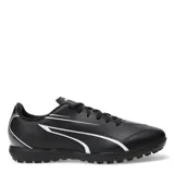Championes de fútbol 5 Puma modelo Vitoria TT, color negro con detalles en blanco. Presentan un diseño deportivo con cierre de cordones, suela de goma resistente para un agarre óptimo y confección en materiales sintéticos de alta calidad.