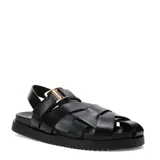 Sandalias chatitas Miss Carol modelo Siena, color negro, de estilo romano con tiras cruzadas y suela plana con plataforma baja. Cuentan con tira ajustable en el talón y hebilla metálica dorada en el empeine.