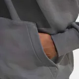 Buzo con capucha Adidas de corte estándar, confeccionado en felpa francesa. Presenta un diseño de hombros caídos, bolsillo tipo canguro, puños y bajo acanalados, y el logo de las 3 Barras estampado en gran tamaño en el pecho.