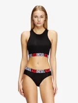 Top deportivo sin aro, confeccionado en algodón elástico, con cuello redondo y banda elástica ancha en la base con el logo de la marca en contraste.