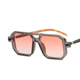 Lentes de sol con marco de acetato color naranja translúcido, diseño geométrico estilo aviador moderno y cristales oscuros con protección UV400.