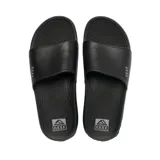 Sandalias Reef tipo ojotas, color negro, con tira ancha sobre el empeine y logo de la marca.