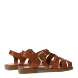 Sandalias franciscanas de cuero negro con tiras cruzadas, suela plana y hebilla metálica dorada lateral.