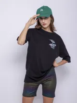 Calza ciclista negra con destellos metalizados y degradé de colores.