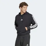 Canguro deportivo Adidas de felpa francesa color negro, con capucha ajustable, bolsillo frontal tipo canguro y las icónicas tres tiras blancas en las mangas. Cuenta con el logo de la marca bordado en el pecho.