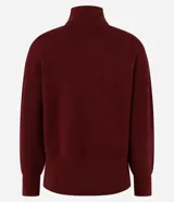 Suéter de manga larga confeccionado en tricot, con cuello alto y diseño de bordado de rombos en relieve. Presenta puños y ruedo acanalados.