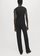 Pantalón de punto fino negro, de tiro medio y diseño recto con cintura elástica sin cierre.