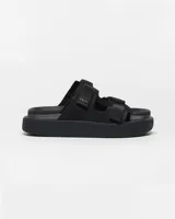 Sandalias tipo trekking marca Veja, color negro, con tiras ajustables de velcro y suela de plataforma con diseño texturizado.
