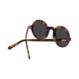 Lentes de sol redondos con armazón de carey (caramelo/marrón) y cristales oscuros. La marca "Indie" está impresa en la esquina superior izquierda del lente izquierdo.