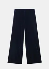 Pantalón wide leg de terciopelo color azul marino, de tiro medio y cintura con goma elástica sin cierre.