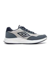 Championes Umbro modelo Volcan para hombre, en tonos de azul y gris claro, con cordones azules y suela blanca. Presentan el logo de Umbro en el lateral.