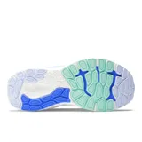 Championes de running New Balance modelo 860, color azul con logo plateado y suela blanca con detalles en celeste.