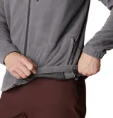 Campera de polar Columbia modelo Fast Trek II, color gris. Presenta cierre frontal completo, cuello alto, bolsillo vertical con cierre en el pecho y bolsillos laterales con cierre.