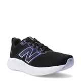 Championes de running New Balance modelo 460, color negro con detalles en violeta. Presentan una capellada de malla transpirable con refuerzos sintéticos, logo lateral característico y entresuela blanca amortiguada.