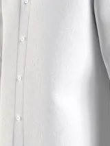Camisa blanca de lino Tommy Hilfiger, de corte regular, manga larga y cuello abotonado.