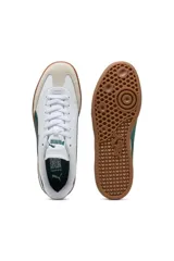 Championes Puma modelo 9T, color negro con franja lateral blanca y suela de goma marrón estilo gum, con puntera de gamuza.