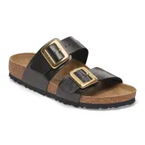 Sandalias Birkenstock modelo Sydney, color negro con hebillas doradas.