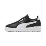 Championes urbanos Puma modelo Shuffle Downtown, color negro con franja lateral blanca y suela de plataforma blanca. Presenta detalles en dorado en el logo lateral y lengüeta.