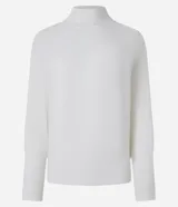 Blusa de punto acanalado color tostado, con cuello alto, mangas largas y puños ajustados. Confeccionada en viscosa, poliéster y poliamida.