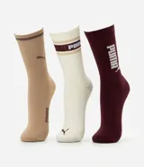 Pack de tres pares de medias largas de algodón Puma en tonos beige, blanco y bordó, con detalles de la marca.