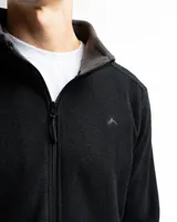 Campera de polar azul marino con cierre frontal completo, cuello alto y bolsillos laterales con cierre. Presenta un diseño liso con un pequeño logo bordado en el pecho.
