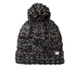 Gorro de lana Rip Curl Classic Reg Pom Pom Beanie, color negro con detalles en blanco y beige, con pompón en la parte superior y etiqueta con logo de la marca en el borde.