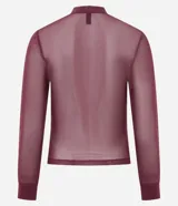 Blusa de manga larga confeccionada en punto con tule y transparencia, con cuello alto y acabado con sutiles puntos de brillo. Presenta un diseño ajustado al cuerpo.
