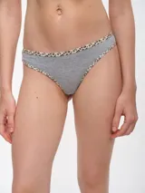 Colaless negra con ribete estampado animal print.