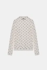 Top de punto fino semitransparente con cuello subido y manga larga, con estampado de lunares.