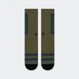 Medias Stance OG negras con rayas blancas horizontales en el tobillo y logo de la marca en la caña.