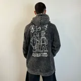 Canguro oversize de color gris con efecto lavado, con capucha y estampado gráfico de Popeye en la espalda.
