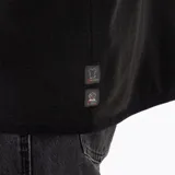 Buzo polar de hombre con cierre frontal parcial y cuello alto. Confeccionado en microfleece de poliéster reciclado, cuenta con puños y cuello con sujeción elástica y logo de la marca bordado en el pecho.