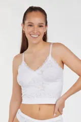 Bralette blanco con encaje y jacquard, con tirantes finos regulables.