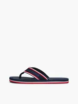 Ojotas Tommy Hilfiger con base azul marino y tiras de poliéster con el logo de la marca en blanco y rojo.