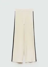 Pantalon palazzo de tejido de punto fino color beige, con cintura elástica y bandas laterales en contraste color negro.