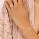 Pulsera de plata 925 con cadena de eslabones y cinco dijes circulares de cuarzo rosado.