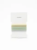 Pack de cinco coleros elásticos para el cabello en tonos pastel y metalizados, incluyendo colores crema, dorado, verde menta y plateado.