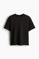 Remera de manga corta en tejido de punto waffle de algodón pesado, con cuello redondo acanalado y bajo recto. Presenta un corte estándar.