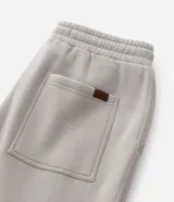 Pantalón recto color negro de algodón y poliéster, con cintura elástica con lazo ajustable, bolsillos laterales y diseño liso.