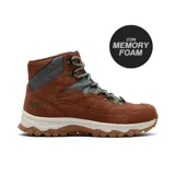 Bota de trekking Hi-Tec modelo Cailin, confeccionada en gamuza color marrón con paneles acolchados en gris. Cuenta con cordones reforzados, suela dentada para mayor tracción y tecnología Memory Foam en la plantilla para mayor confort.