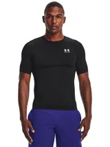 Remera de compresión Under Armour HeatGear negra de manga corta, con logo blanco en el pecho.