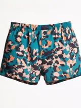 Bóxer de algodón con cintura elástica y estampado abstracto en tonos turquesa, negro y salmón/naranja.