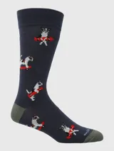 Calcetines largos de color azul marino con diseño estampado de perros de raza Jack Russell Terrier realizando acrobacias en monopatín (skateboard) con detalles en rojo y blanco. El talón y la punta son de color verde oliva.