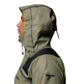 Campera impermeable Columbia modelo Whistler Peak Shell Outdry, de color verde militar con inserciones negras en hombros y codos. Cuenta con capucha ajustable, cierre frontal y bolsillos con cremalleras selladas, y tecnología OutDry Extreme.