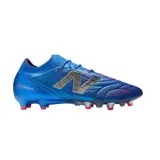 Championes de fútbol New Balance Tekela color azul con detalles en plateado y rojo.